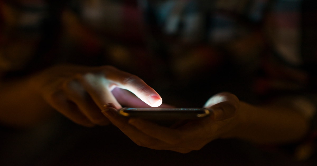 woman using her mobile